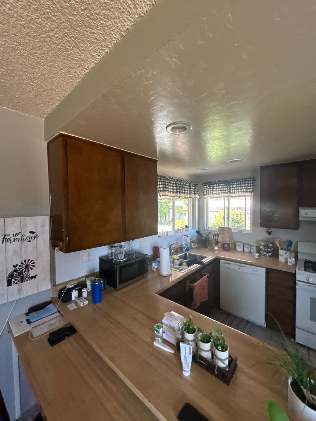 Kitchen before the remodel — dark cabinets and dated finishes